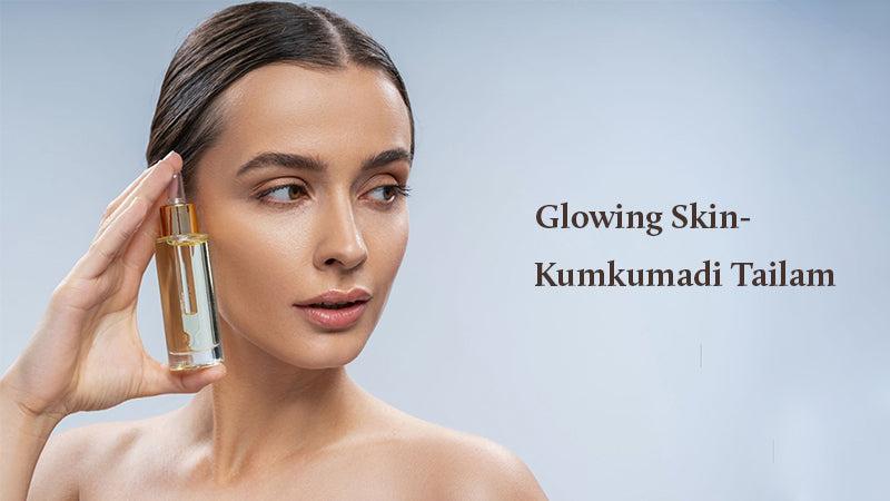 Lady is holding kumkumadi tailam 