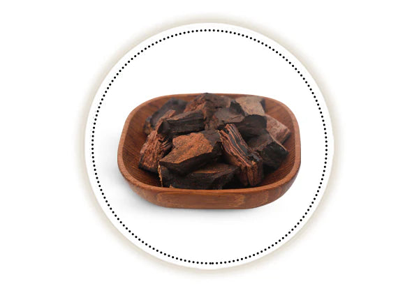Wooden bowl with khadir bark on a white background