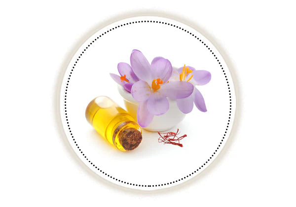 Kumkumadi flowers and oil on white background 