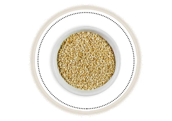 White bowl with sesame seeds on a white background