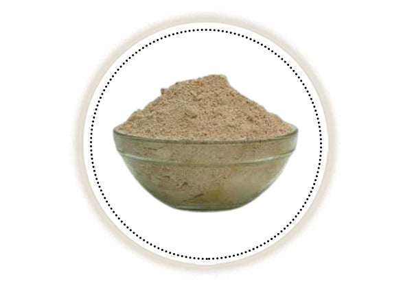 Bowl of yashad bhasma powder on a white background